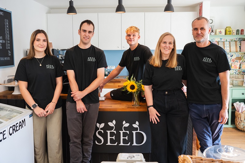 Staff standing behind the counter at SEED farm shop café.