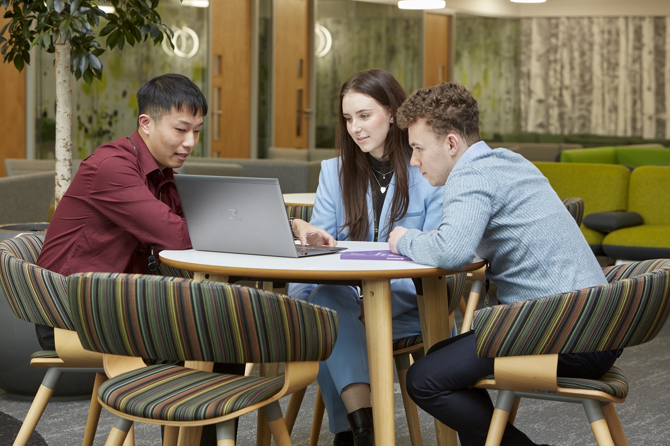 Graduates meeting in breakout area